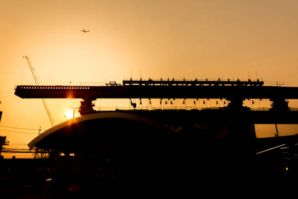 istock Silhouette of Bridge structure being built on an evening sky background 1088002278