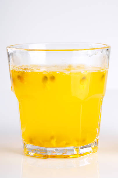 istock Glass of passion-fruit juice on white background 1088007708
