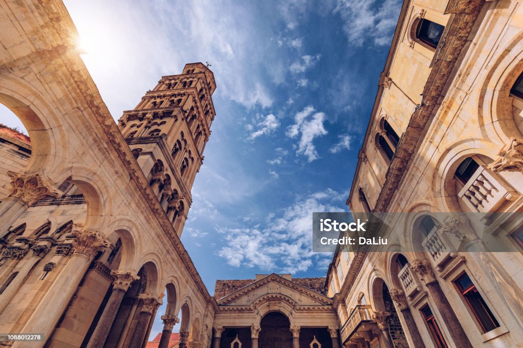 Diocletian's Palace's peristyle in front of Cathedral of Saint Domnius' bell tower in Split, Croatia. Diocletian palace UNESCO world heritage site in Split, Dalmatia, Croatia. Separation Stock Photo