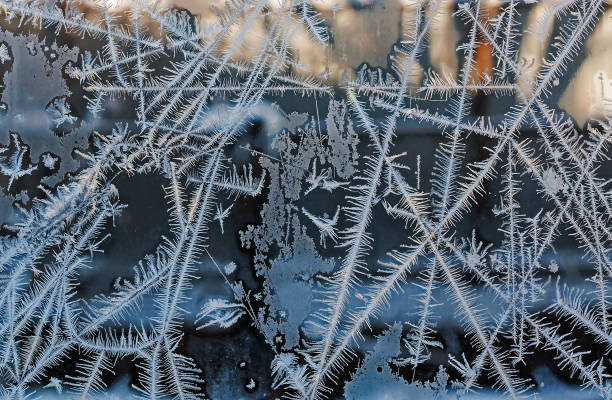 istock intersecting to frost line, patterns on the window glass 1088013900