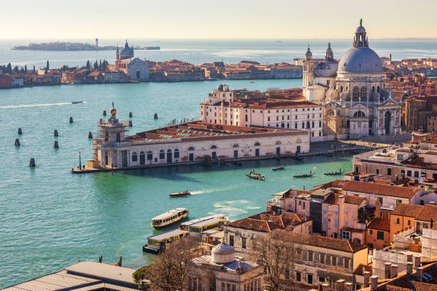 aerial view of the grand canal and basilica santa maria della salute, venice, italy. venice is a popular tourist destination of europe. venice, italy. - venice italy canal famous place grand canal imagens e fotografias de stock