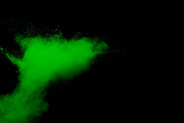istock Green color powder explosion cloud on black background.Green dust splash on dark background. 1088048674