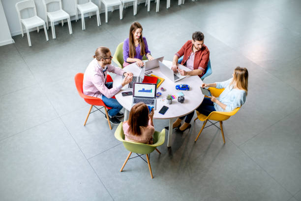 istock People working at the round table indoors 1088055988