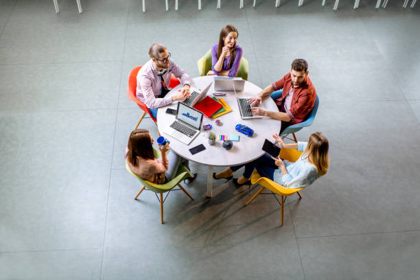 istock People working at the round table indoors 1088056004