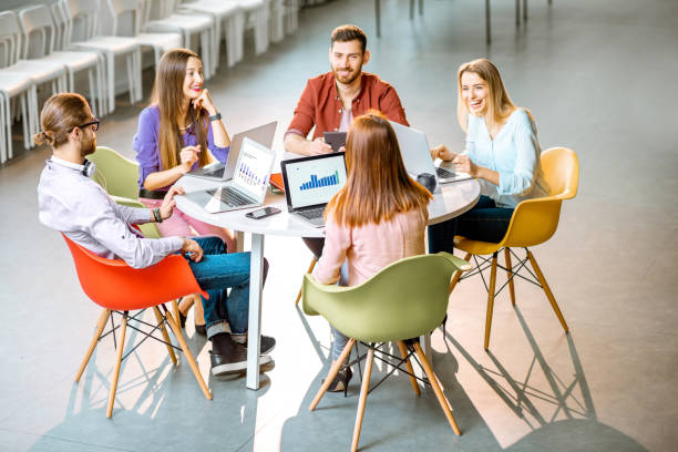 istock People working at the round table indoors 1088056022