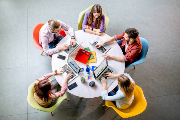 istock People working at the round table indoors 1088056042