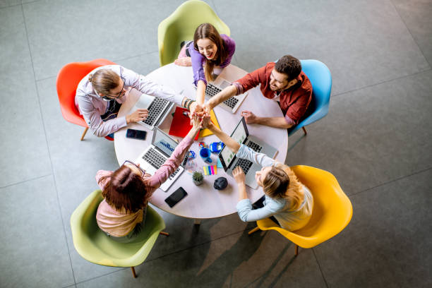 istock People working at the round table indoors 1088056056