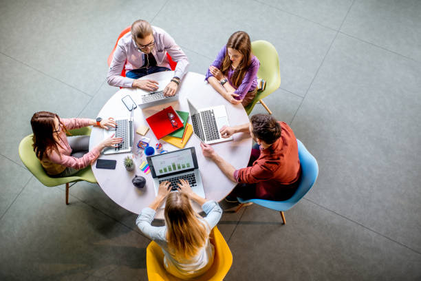 istock People working at the round table indoors 1088056060