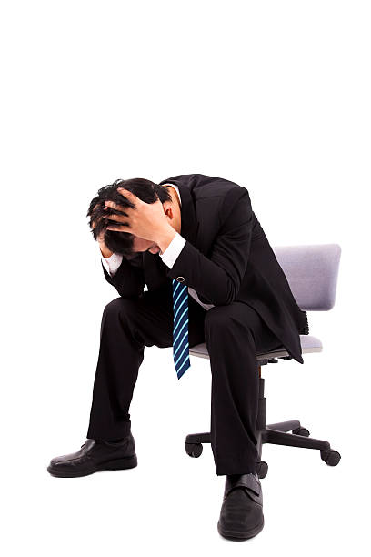 istock Businessman is depressed  with holding his head 108806275