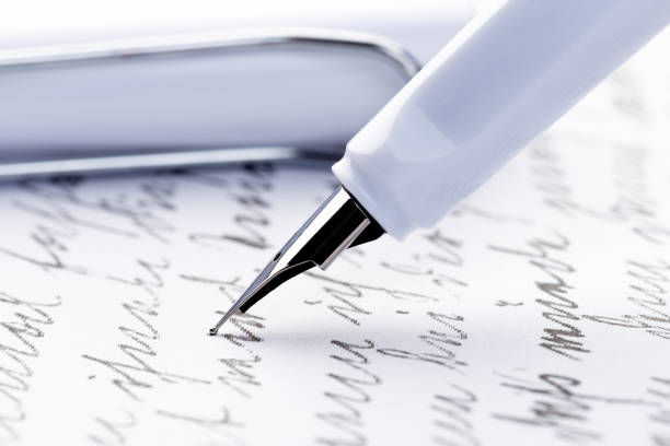 istock yellow fountain pen writing a letter 1088065412
