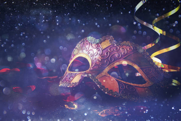 istock elegant venetian, mardi gras mask on glitter background 1088065480