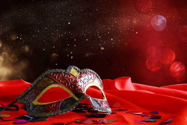 istock elegant venetian mask on red silk background 1088065482