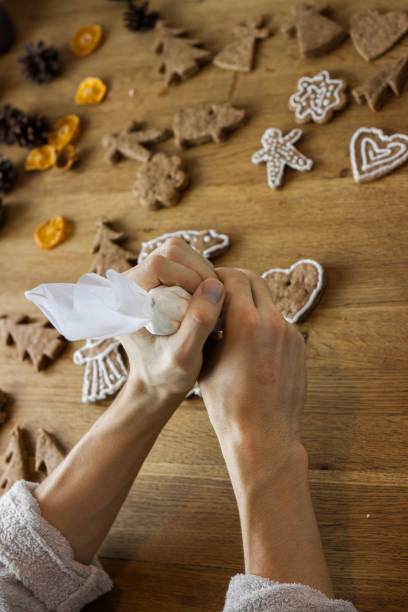 istock Christmas gingerbread icing decorating process. Homemade sweet cookies 1088065780