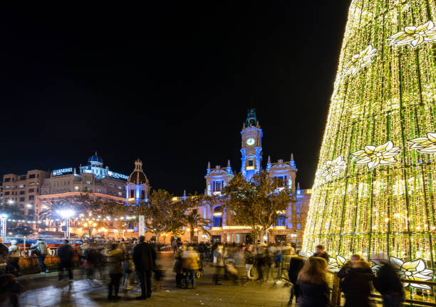 Christmas fair with carousel on Modernisme plaza of the city hall of Valencia, Spain. stock photo