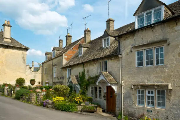 Photo of Cotswold stone houses line the streets in Painswick