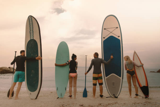 istock Group of surfers taking a break on the beach 1088071032