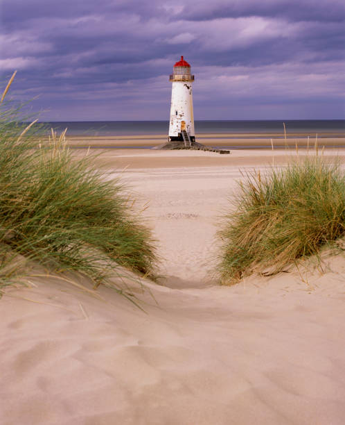 Lighthouse and coastal dunes with dry grass in Los Canos de Meca, near Cape Trafalgar. Los Canos de Meca, Tarifa, Andalusia, Spain. 1 September 2025.