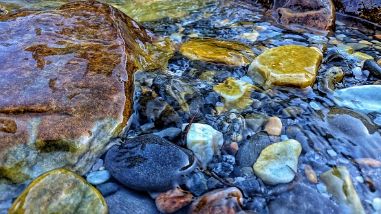 Water streams running through the stones or pebbles.