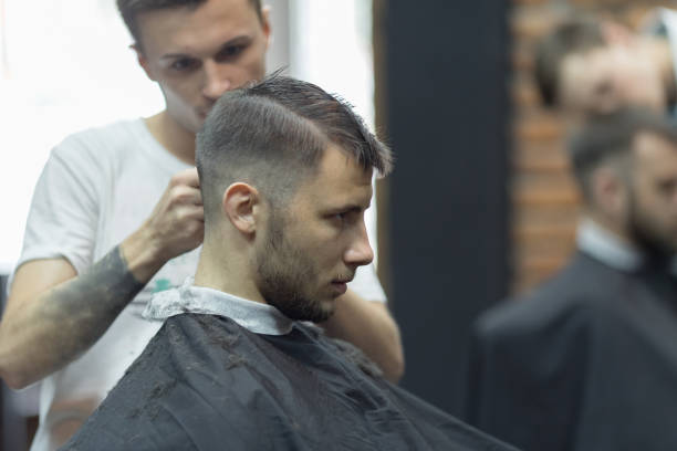 istock Young handsome man in barbershop 1088079946
