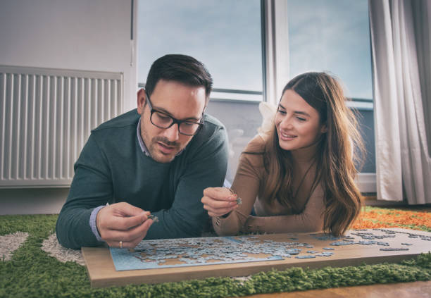 istock Couple with puzzle on floor 1088082570