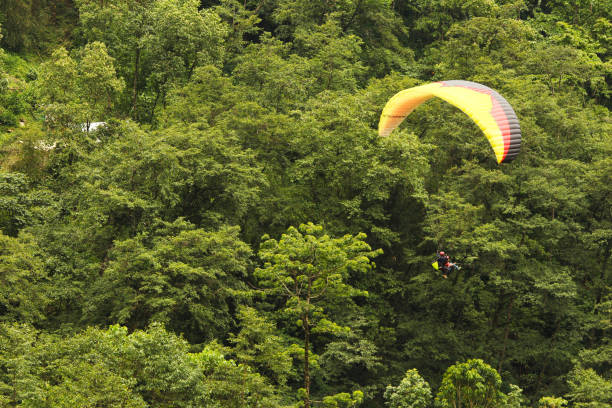 istock two people paragliding in the sky 1088083864