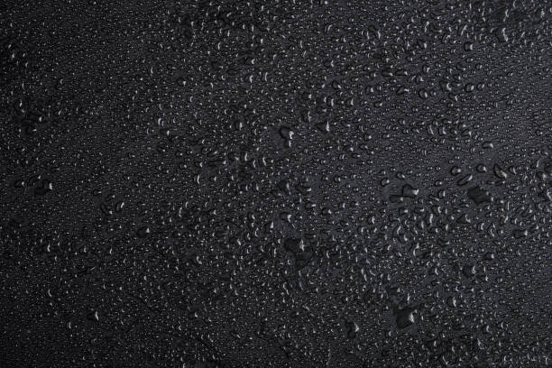 istock Dark gray black slate background with water drops or natural stone texture. 1088084166