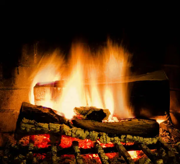 Fire burning bright in fireplace. Isoalted. Stock Image.