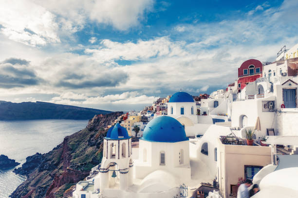 istock Churches in Oia, Santorini island in Greece, on a sunny day with dramatic sky 1088094666