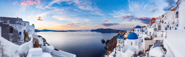 Beautiful panorama view of Santorini island in Greece at sunrise Beautiful panorama view of Santorini island in Greece at sunrise with dramatic sky. santorin stock pictures, royalty-free photos & images