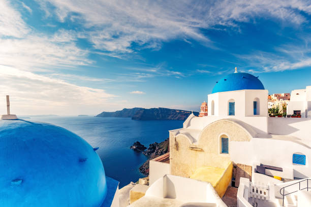 istock Churches in Oia, Santorini island in Greece, on a sunny day with dramatic sky 1088094974