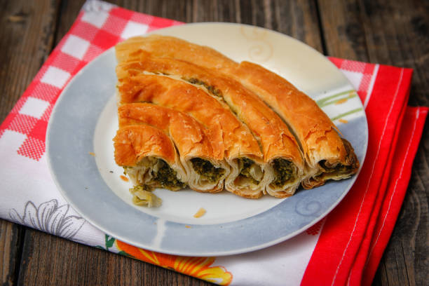istock Pastry with cheese and spinach and red dish towel 1088098476