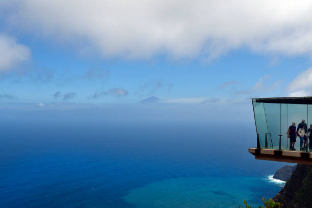 La Gomera, Canary Islands, Spain - April 10, 2018: Unidentified people on skywalk Mirador de Abrante, preferred tourist attraction with view to Tenerife Island