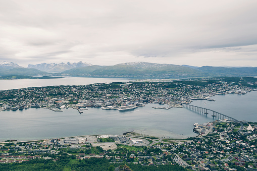 Above view of Tromso city in Northern Norway, cityscape from high Floya Hill at cloudy day.