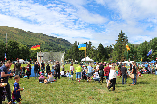 Crieff, Scotland, 21 July 2018: Crowds of spectators enjoy the Lochearnhead Highland Games near Crieff in Scotland. An annual event promoting Highland culture and traditions.