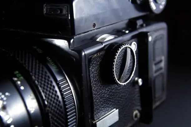 Close up shot of the shutterspeed dial of a vintage medium format film camera.