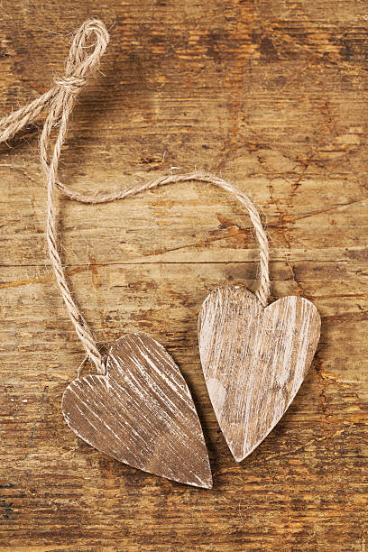 istock tied wooned hearts on old  wood rustic style 108811609