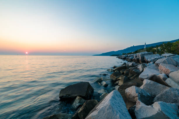 istock Sunset near the old  lighthouse of Trieste 1088125640