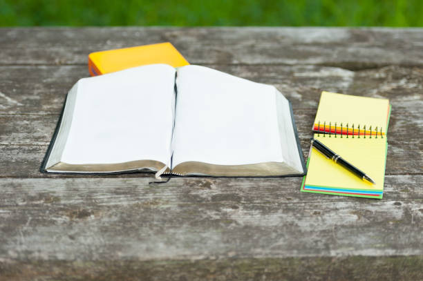 istock Bible Open on a Wooden Table 1088126148