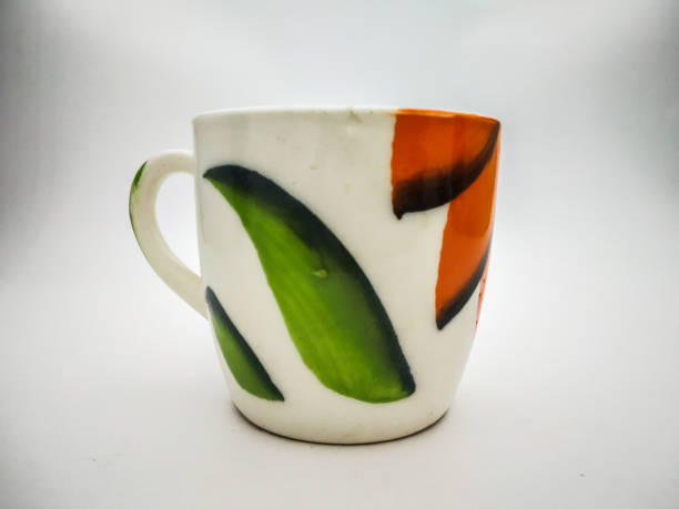 istock Painted cup of tea close up shot in a white background 1088127834