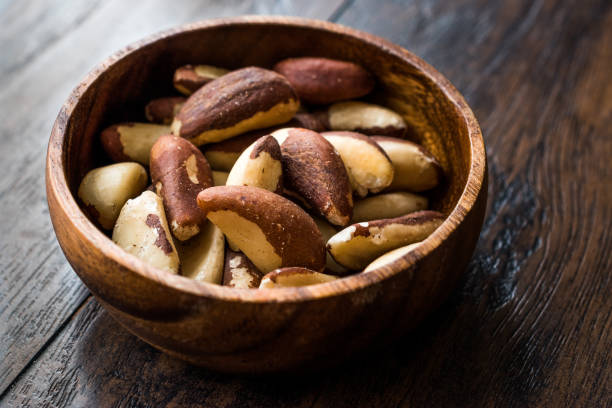istock Brazil Nuts in Wooden Bowl without Shell 1088134420
