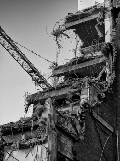 istock monochrome image of a building being demolished showing construction crane 1088136266