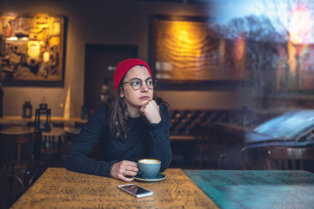 istock Student enjoying a cozy afternoon in a local cafe 1088139910