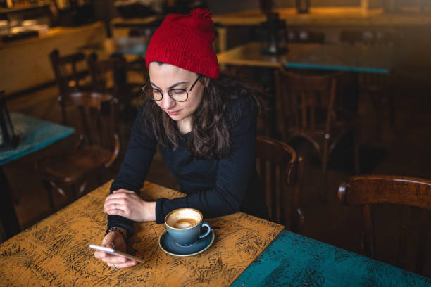 istock Beautiful girl online shopping while taking a relaxing coffee break 1088140068