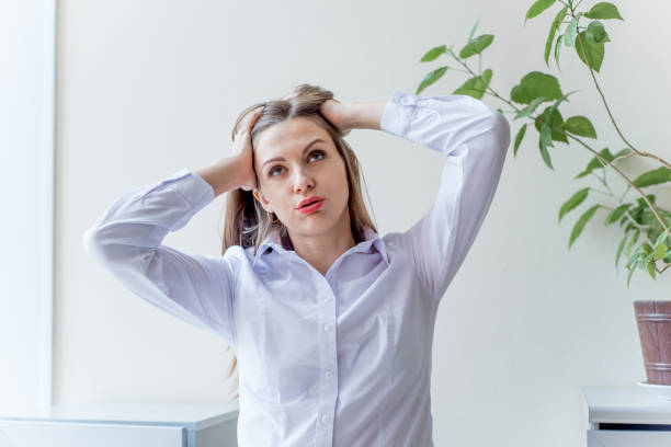 istock a depressed businesswoman under stress at work 1088141756