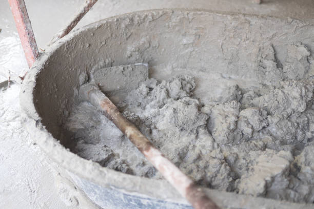 istock Bucket cement mix with on construction site the ingredients. brick, stone, mortar, sand 1088147882