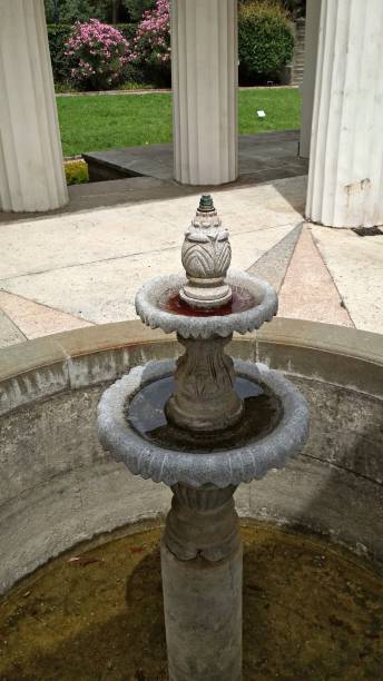 istock Not working, classic, ornamental, stone two-tier fountain close-up. 1088151704