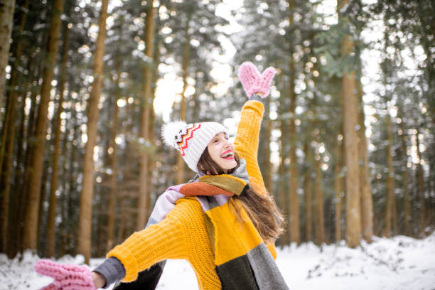 istock Young woman in pine forest during the winter 1088160000