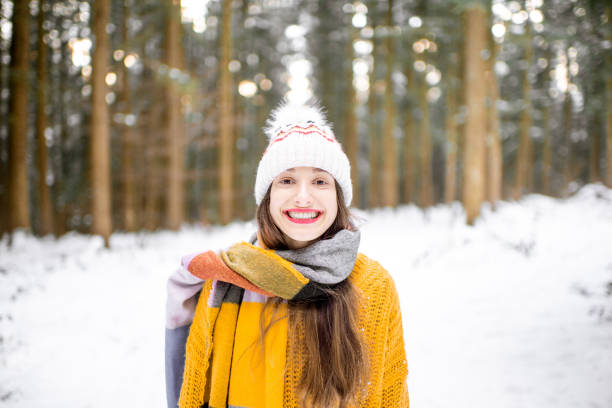 istock Young woman in pine forest during the winter 1088160014