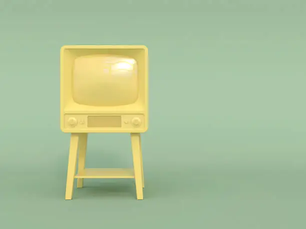 Photo of Old retro tv in monochrome yellow color on a light green background. Pastel colors. Copy space. Cartoon style.