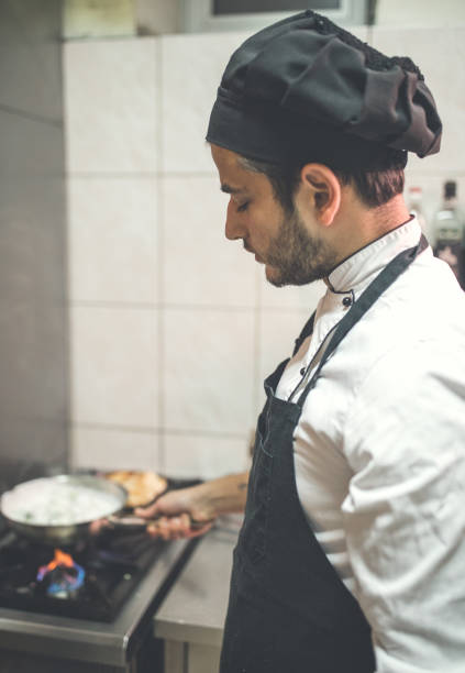 istock Male chef preparing food in kitchen 1088167476